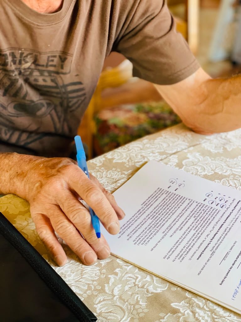 Tiffany Reese-Ellis assisting a client through a document signing